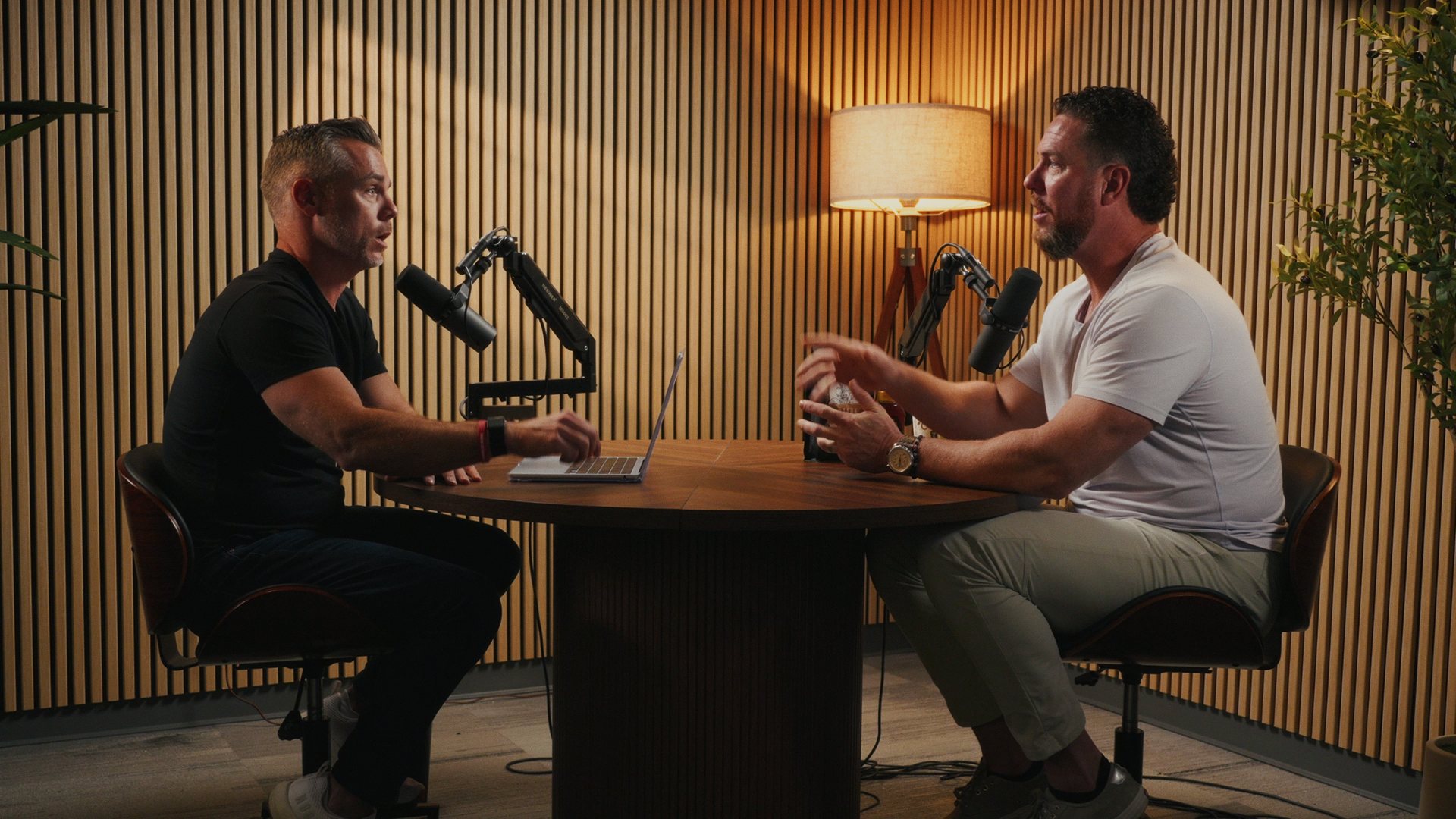 Cole Rodgers and a guest talking across the round table